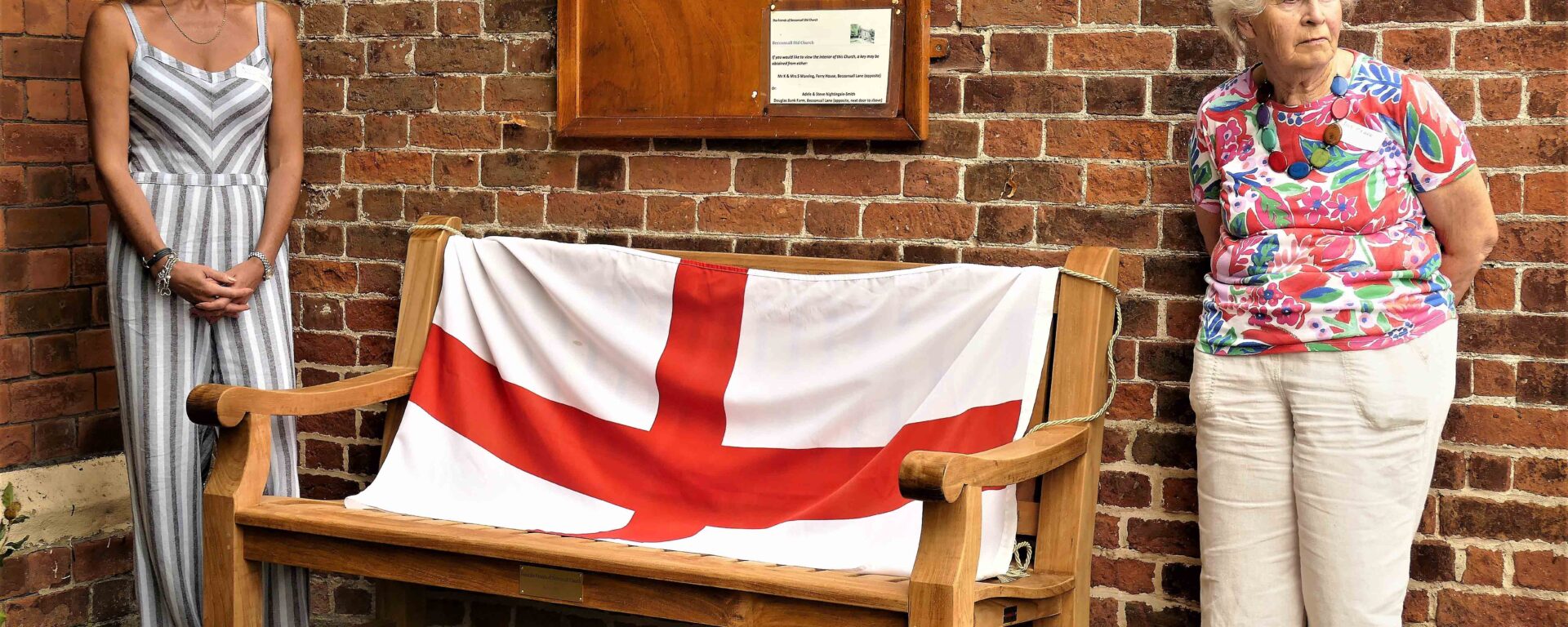 a beautiful memorial bench with a flag