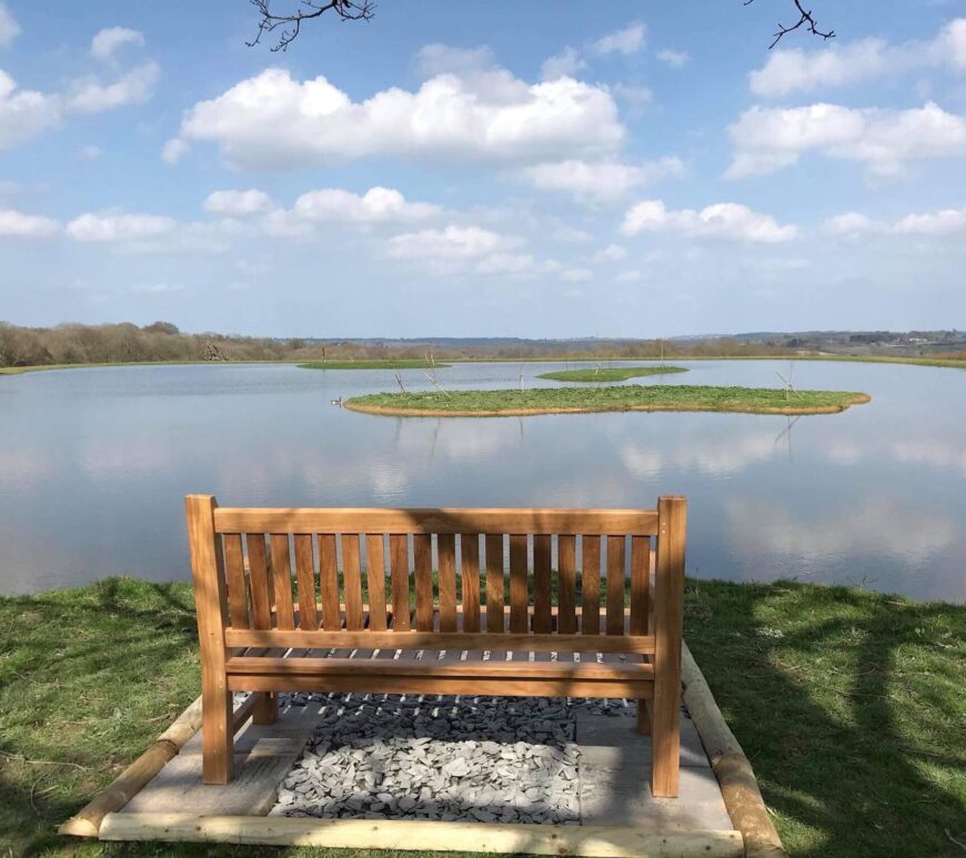 a Remembrance Bench looking over a lake